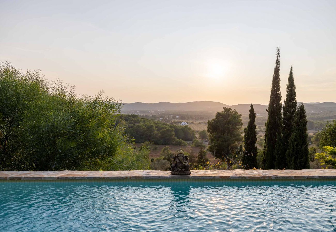 Sunset from the private pool with Ibiza's natural surroundings in the background